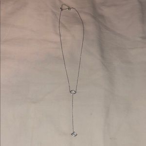 Silver lariat necklace with evil eye